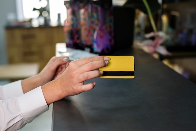 Woman holding credit card mock-up