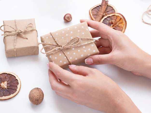 Woman holding decorated gift box