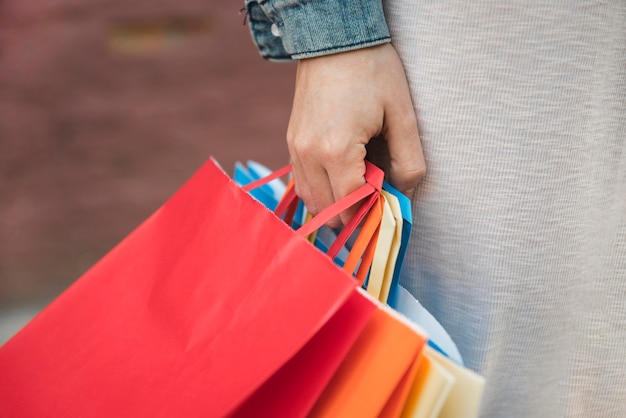 Free photo woman holding different shopping packets