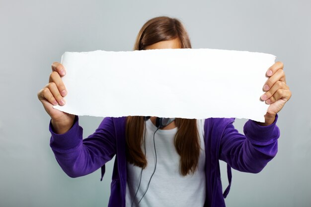 Woman holding empty board