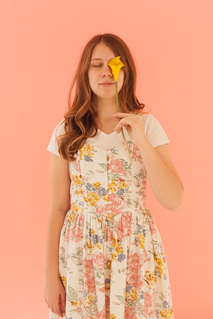 Free photo woman holding flower medium shot