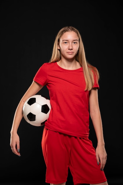 Woman holding football ball