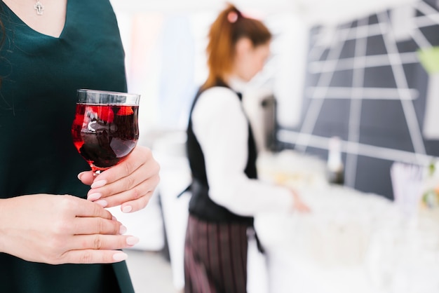 Free photo woman holding glass with alcohol