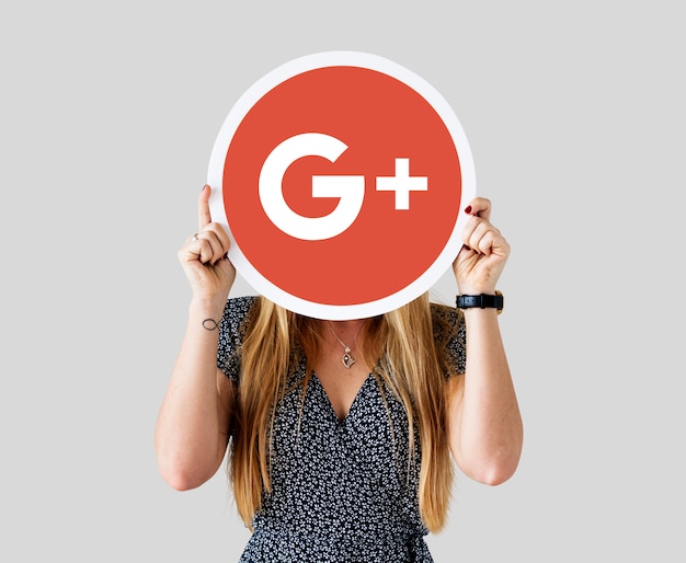 Woman holding a Google Plus icon