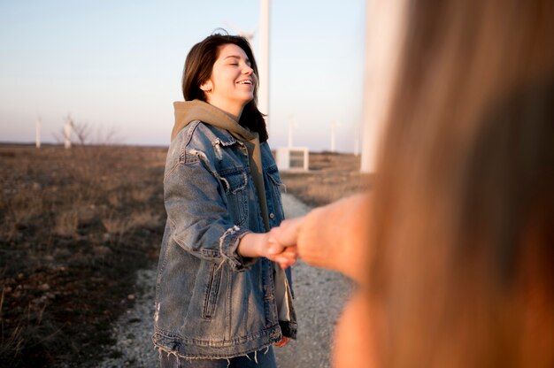 Woman holding hands with her friend