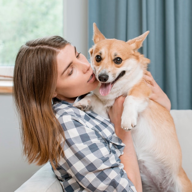 Woman holding her adorable pet dog