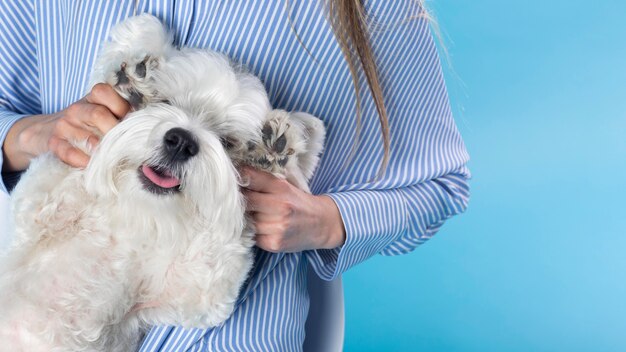 Woman holding her cute dog