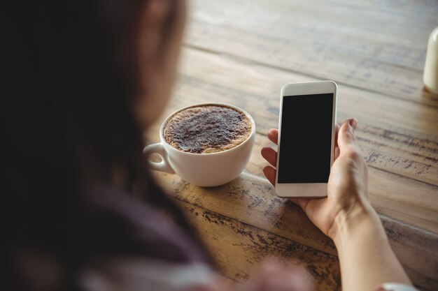 Woman holding mobile phone