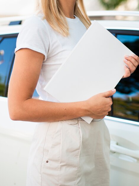 Woman holding a mock-up magazine