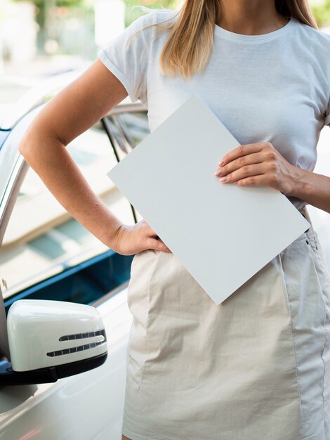 Woman holding a mock-up magazine