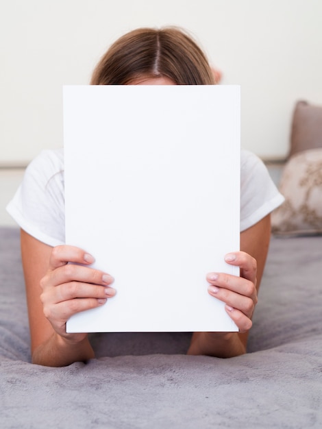 Woman holding a mock-up magazine