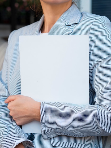 Woman holding a mock-up magazine