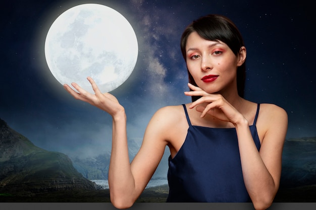 Free photo woman holding moon