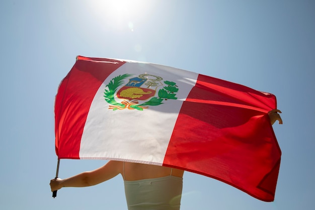 Woman holding the peru flag