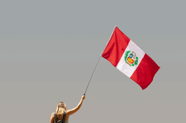 Woman holding the peru flag