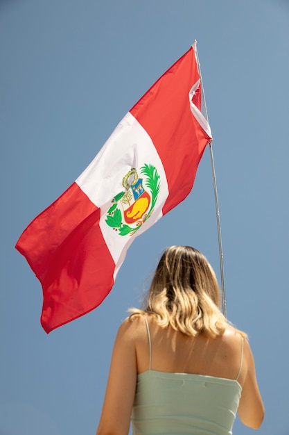 Woman holding the peru flag