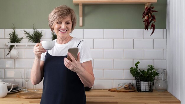 Woman holding phone medium shot