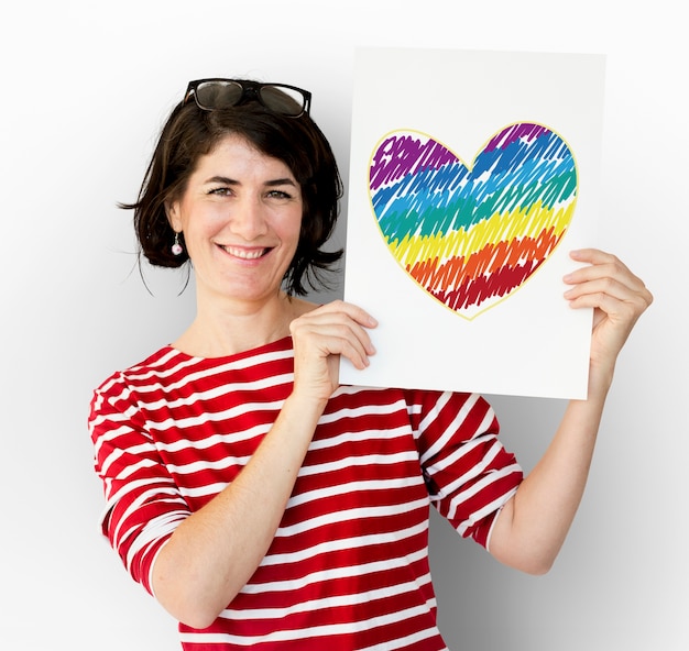 Free photo woman holding placard with lgbt heart icon