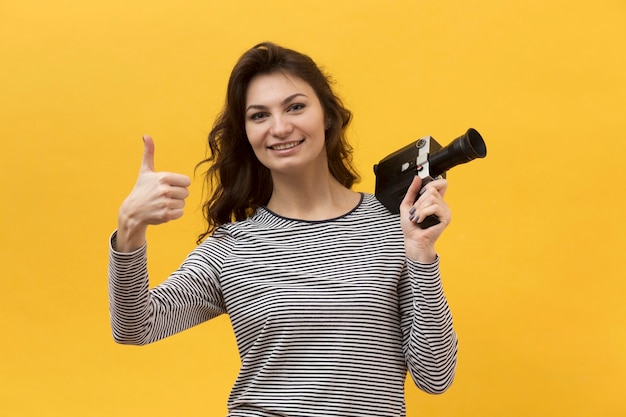 Woman holding a retro camera