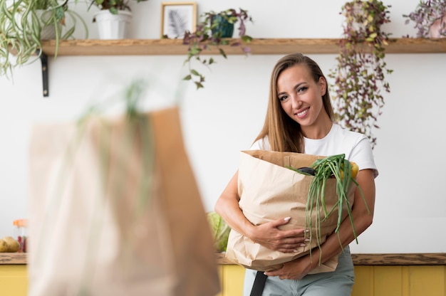 Free Photo woman holding a shopping bag