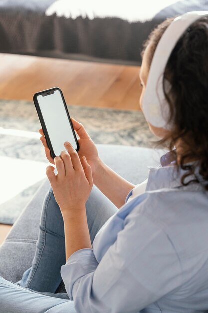 Woman holding smartphone close up