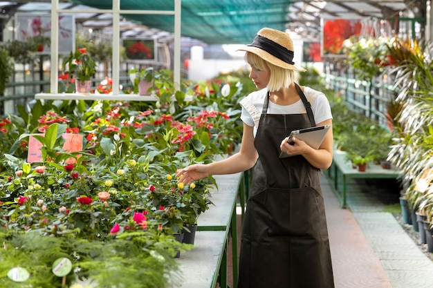 Free photo woman holding tablet medium shot