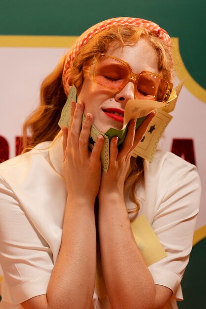 Woman holding tombola tickets front view