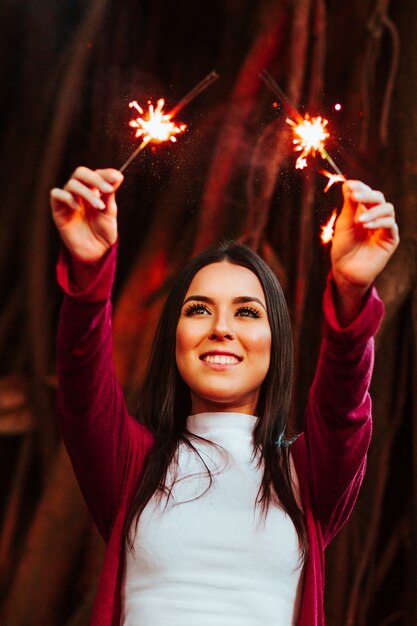 Woman Holding Two Firecrackers