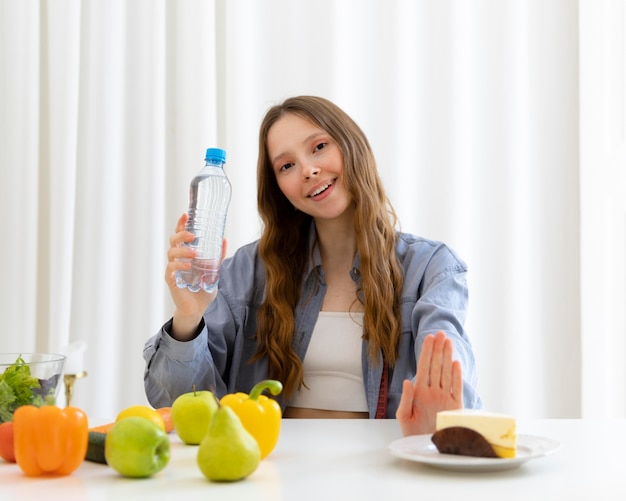 Woman holding water bottle