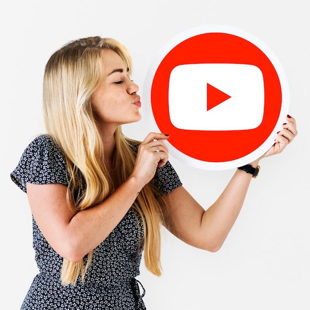 Free Photo woman holding a youtube icon