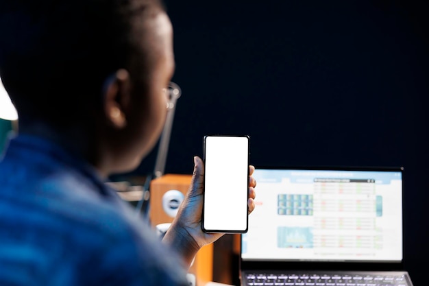 Free photo woman holds device with mockup screen