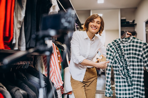 Woman at home choosing cloth from her check-room