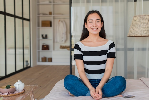 Woman at home meditating