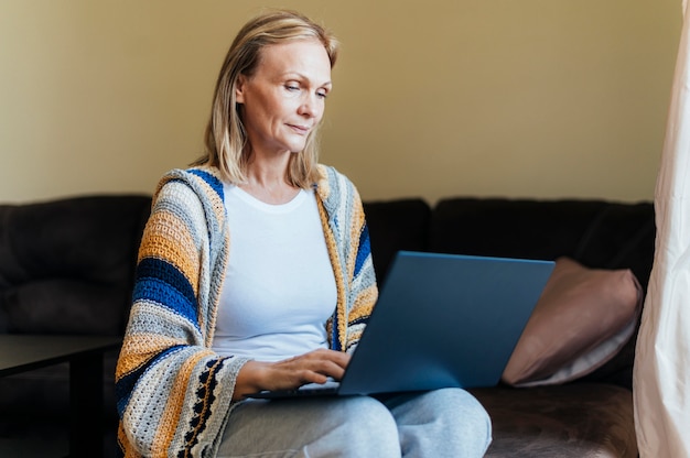 Woman at home during quarantine with laptop