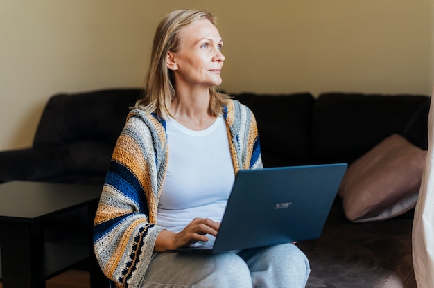 Woman at home during self-isolation with laptop