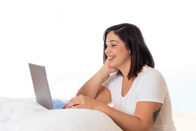 Woman at home using laptop