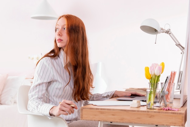 Woman at home working on laptop