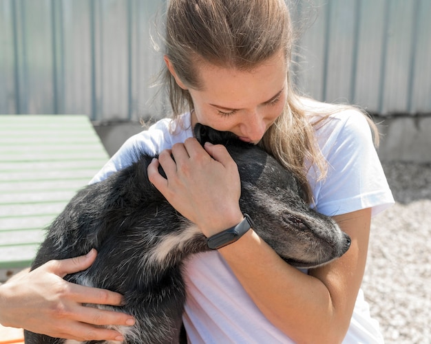 Woman hugging cute rescue dog