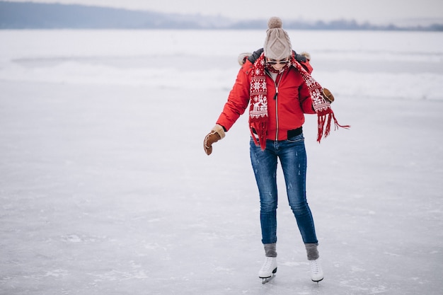 Free photo woman ice skating at the lake