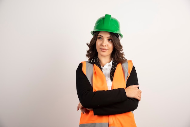 Woman industrial worker posing on white