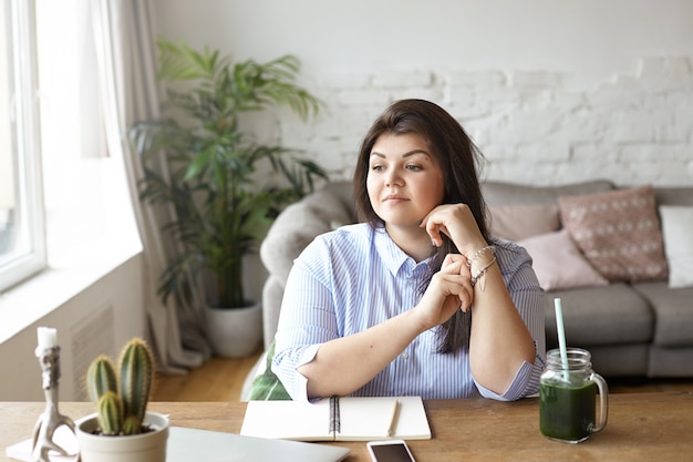 The woman is working in a modern workspace