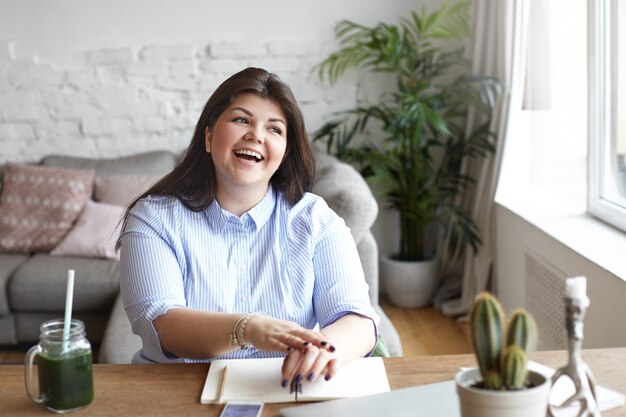 The woman is working in a modern workspace