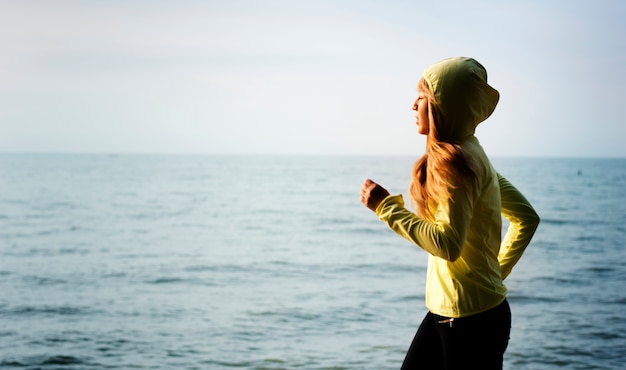 Free photo woman jogging on a beach