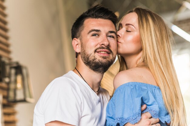 Woman kissing her boyfriend