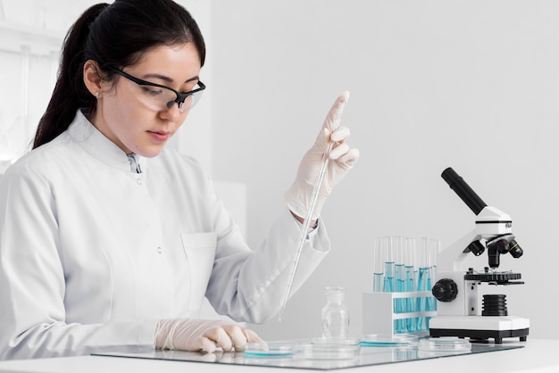 Woman in lab doing experiments