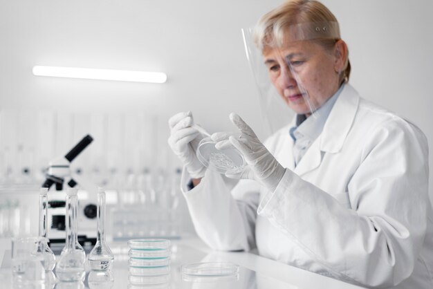 Woman in laboratory doing experiments