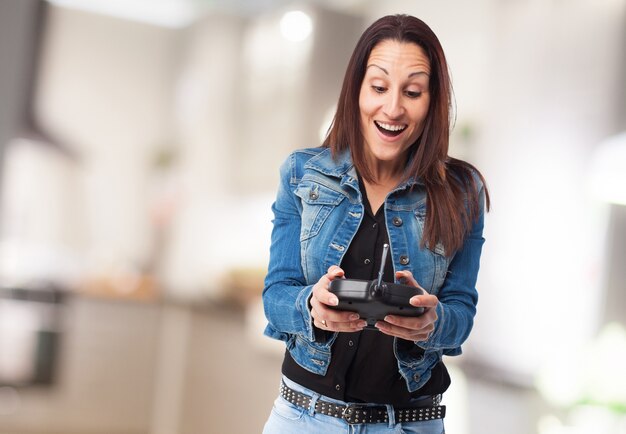 Woman laughing with a radio control