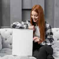 Free photo woman leaning on blank paper