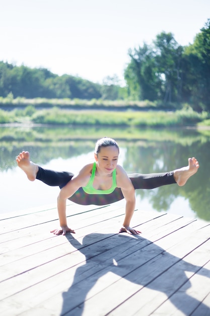 Woman lifting with her arms and legs spread