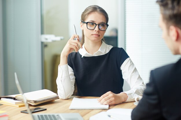 Woman listening to colleague